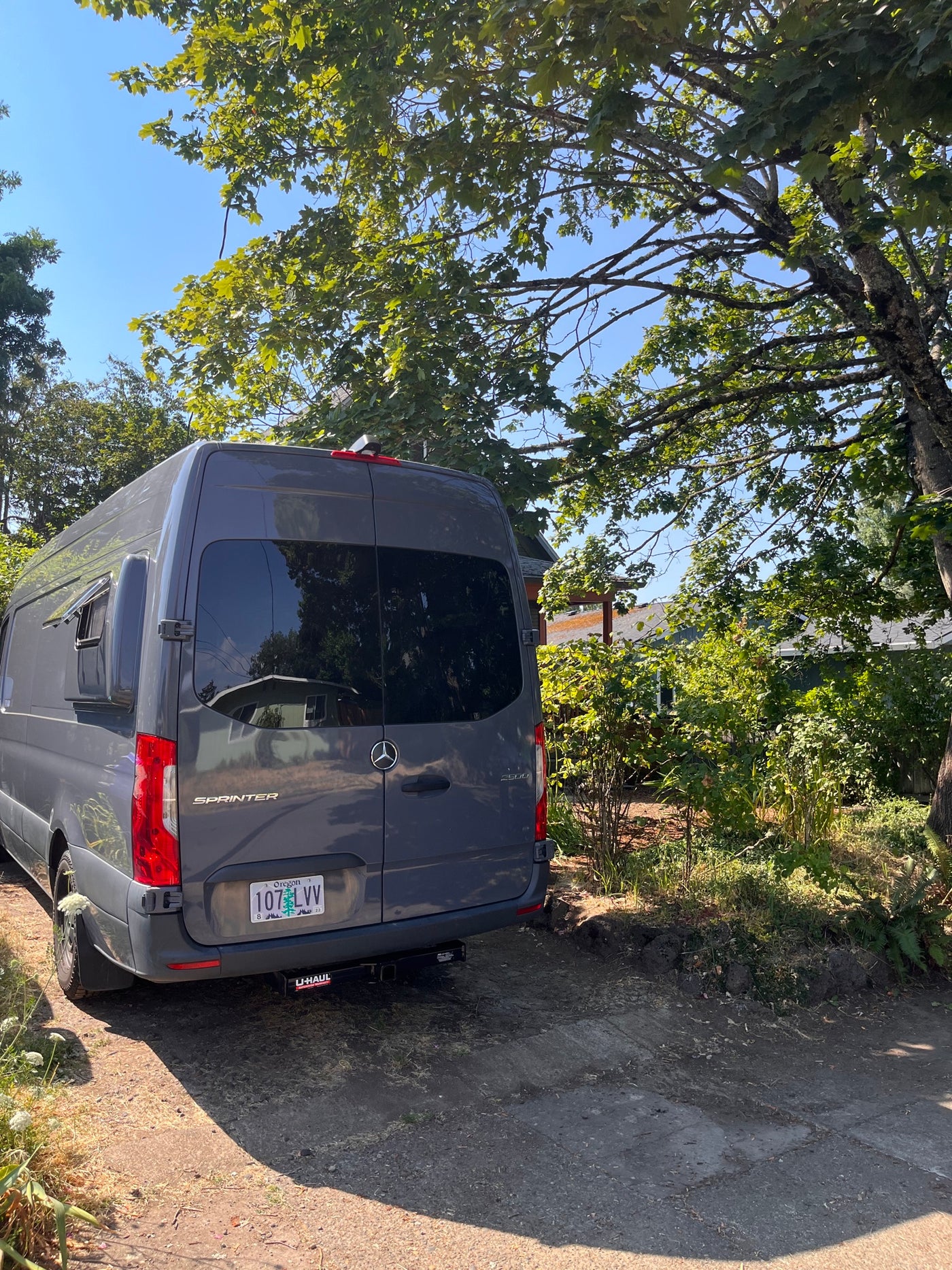 Gray Mercedes-Benz Sprinter van, an RV rental, parked on a sunny path with an Oregon plate. — photo 10