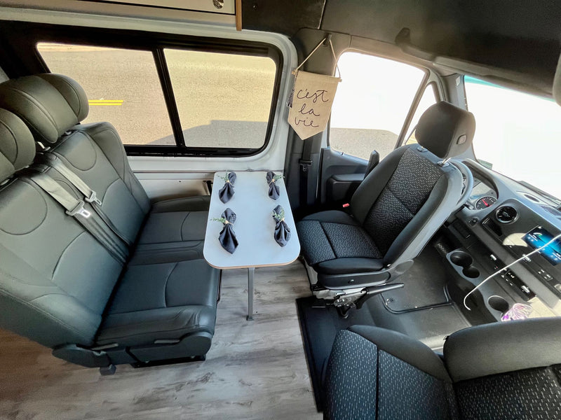  and palm trees under a bright sky.|Inside an RV rental: integrated kitchenette — photo 5