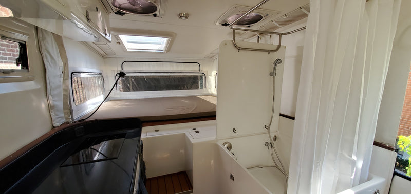  and cozy seating.|Spacious and bright rv rental interior featuring a practical kitchen — photo 6