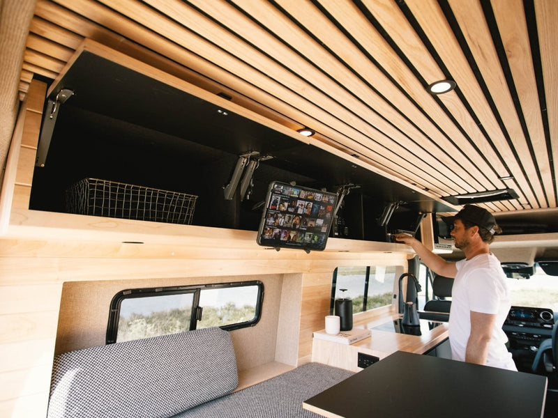  packed with NEMO gear for adventure. Perfect for your next modern journey.|This RV rental showcases an open camper van's custom wood interior — photo 12
