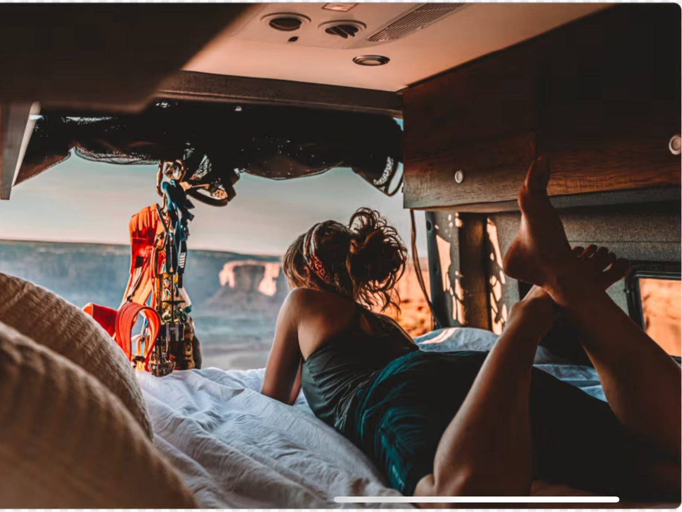  and two dogs play cards inside a modern RV rental