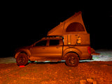 This rugged Ford Ranger Tremor RV rental, equipped with an overland rooftop tent, is set for a night of stargazing camping.