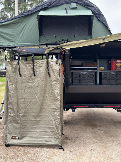 This RV rental setup features a rooftop tent, privacy shower, and ample storage for your next adventure.