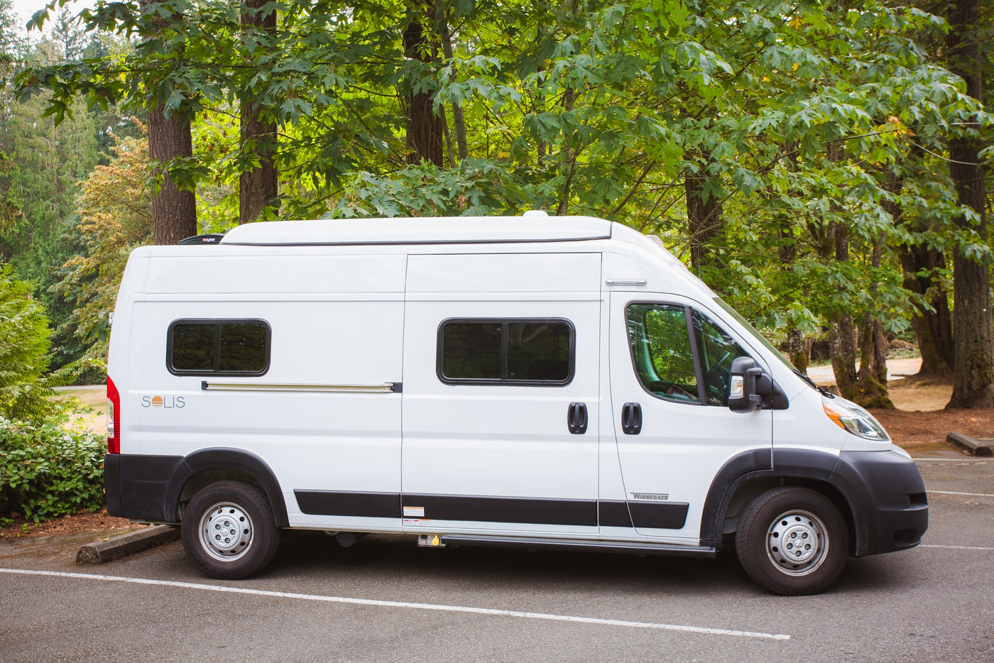  ideal for rv rental adventures in nature.|Explore nature with this white Winnebago Solis camper van. Ideal for an RV rental adventure — photo 3