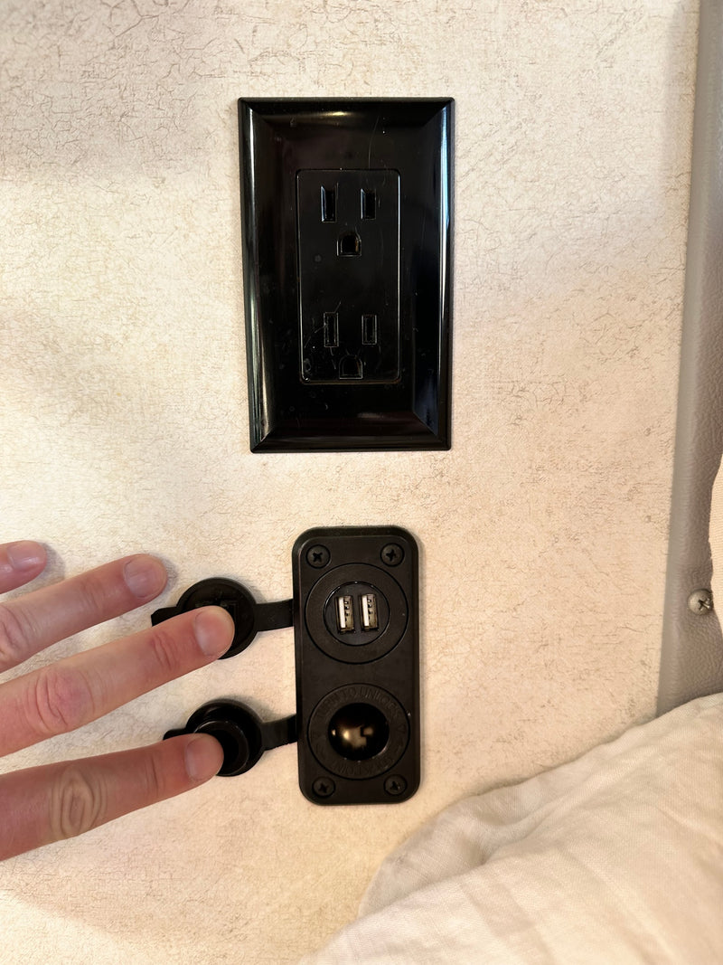  parked on a sunny residential street in Oregon.|RV rental interior: A compact kitchen area with a two-burner stove — photo 17