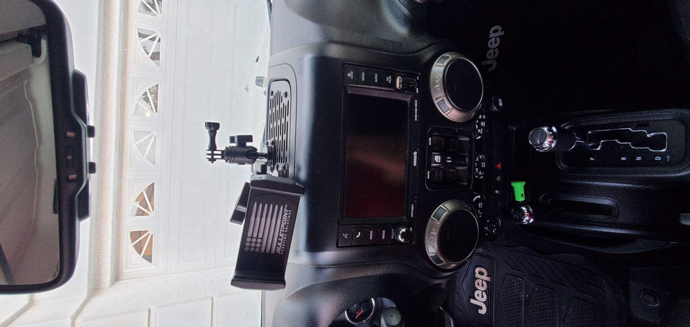 Jeep interior with tech mounts, ready for adventure. Perfect for road trips or an RV rental journey.