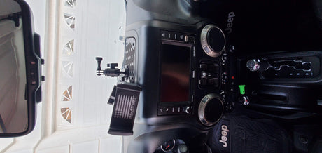Jeep interior with tech mounts, ready for adventure. Perfect for road trips or an RV rental journey.