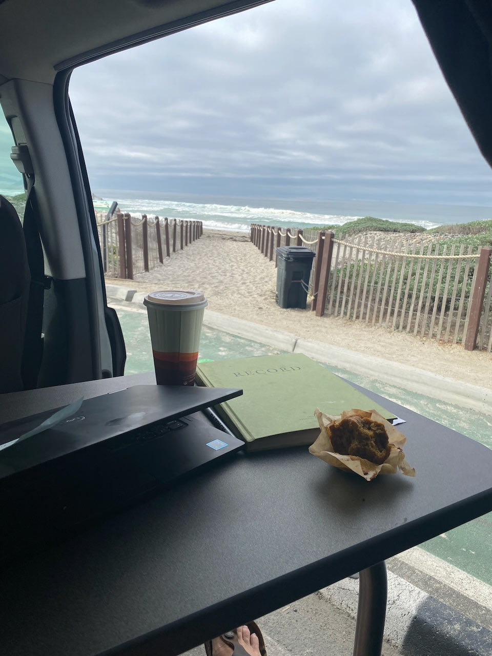  shows organized storage bins & a yoga mat. Four mountain bikes on a hitch rack.|Cozy RV rental kitchenette with "Tacos" sign
