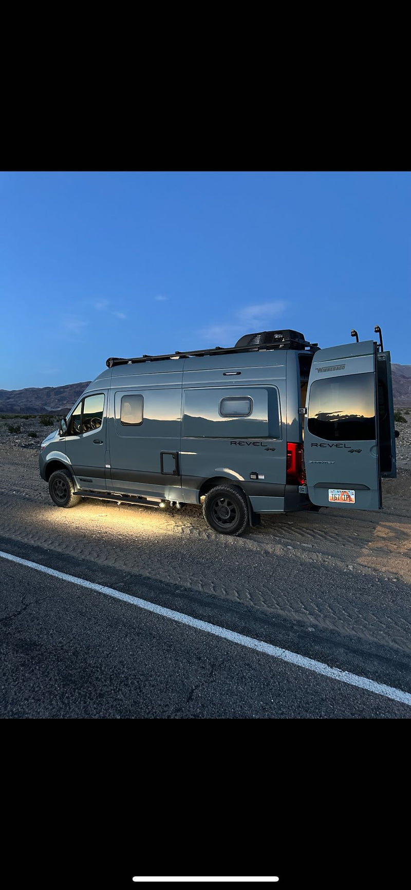  parked on an|Winnebago Revel RV rental parked on a desert road — photo 8