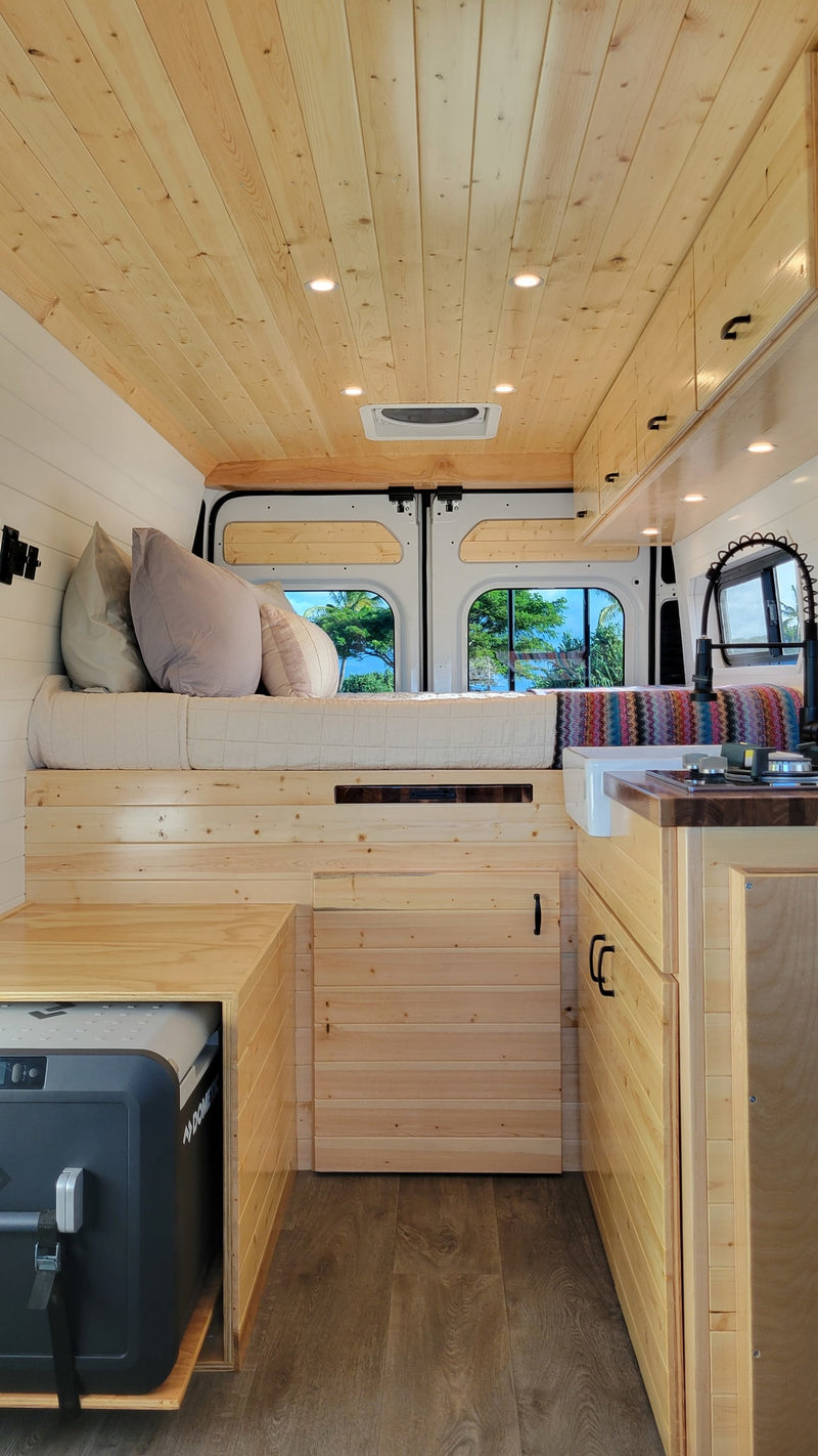 Cozy RV rental interior with light wood paneling — photo 1