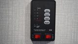 RV rental control panel showing indicators for fresh, gray, and black water tanks, battery, and pump/heater switches.