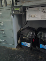 RV rental mobile power: Magnum Energy inverter control, Deka Marine batteries, and storage drawers.