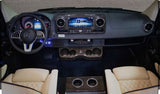 Spacious Mercedes-Benz RV rental interior with luxurious dashboard, modern infotainment, and quilted seats.