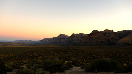 Explore vast desert landscapes & majestic mountains at sunset, perfect for an RV rental adventure in nature.