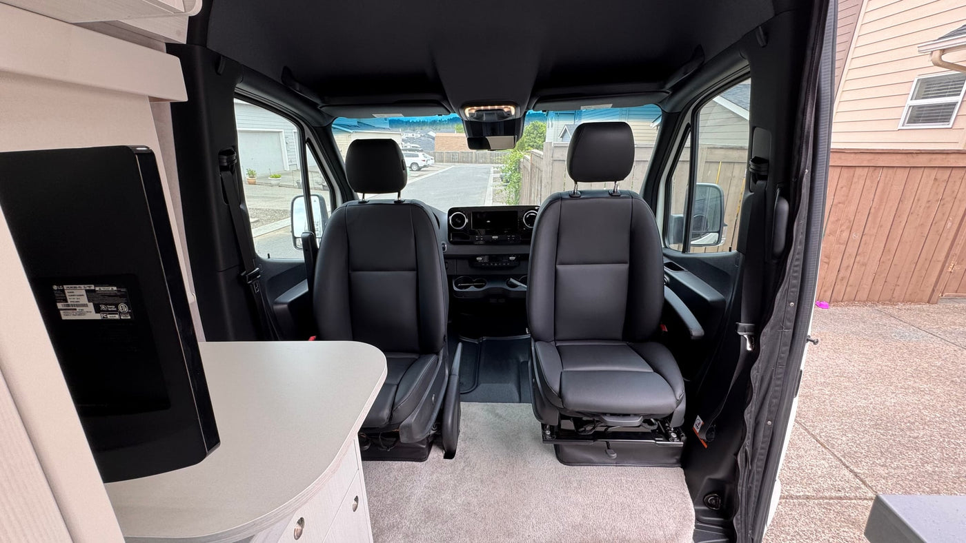  clean interior looking to the front cabin with black seats — photo 13