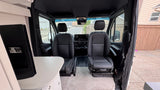  clean interior looking to the front cabin with black seats