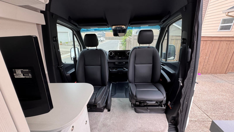  clean interior looking to the front cabin with black seats — photo 13