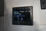 A Furrion RV entertainment system, tuned to FM 104.5, in an rv rental. Features AUX, USB, HDMI, and Bluetooth for all your audio needs.