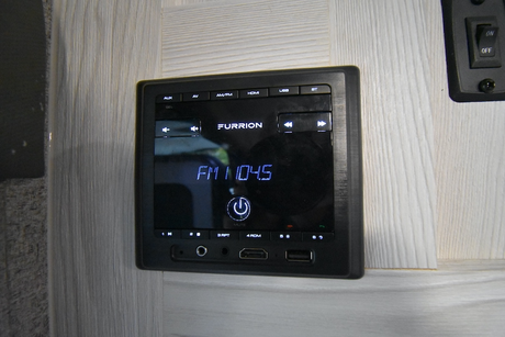 A Furrion RV entertainment system, tuned to FM 104.5, in an rv rental. Features AUX, USB, HDMI, and Bluetooth for all your audio needs.
