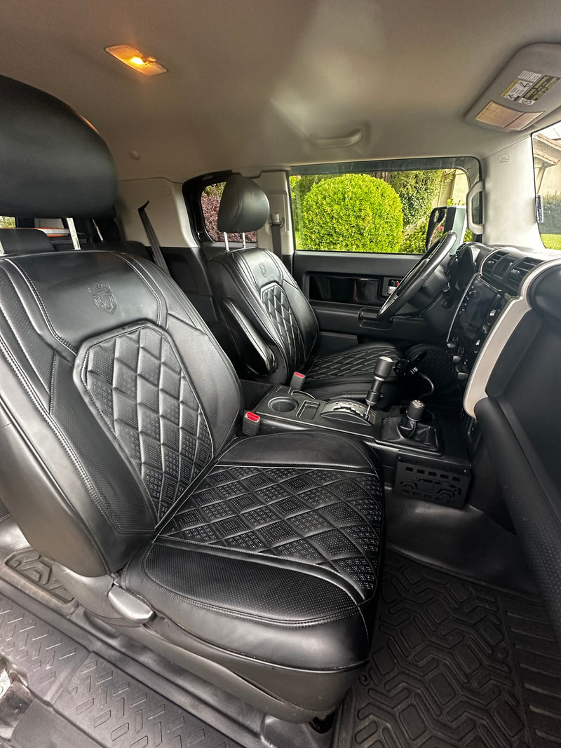 Clean car interior: custom quilted black leather seats, durable floor mats. Ready for your next road trip or rv rental adventure. — photo 9