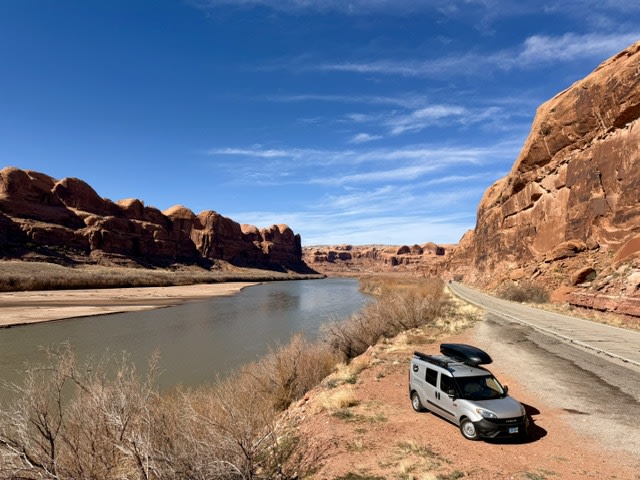  & serene lake view await your next adventure.|Compact silver rv rental parked at a scenic pull-off — photo 3