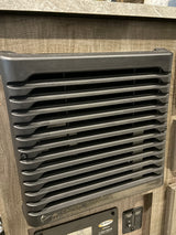RV rental interior: A wall-mounted heater/converter vent with caution warning, above a Go Power control panel.