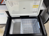 Open ICECO portable fridge/freezer for your rv rental. Interior shows a wire basket and product info on the lid.