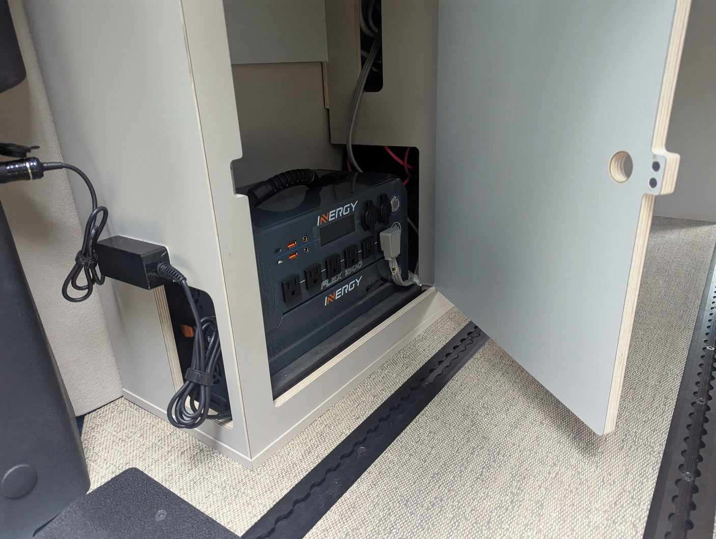 Close-up of an Inergy Flex 1500 portable power station, a key feature in this RV rental, providing power via AC/USB.