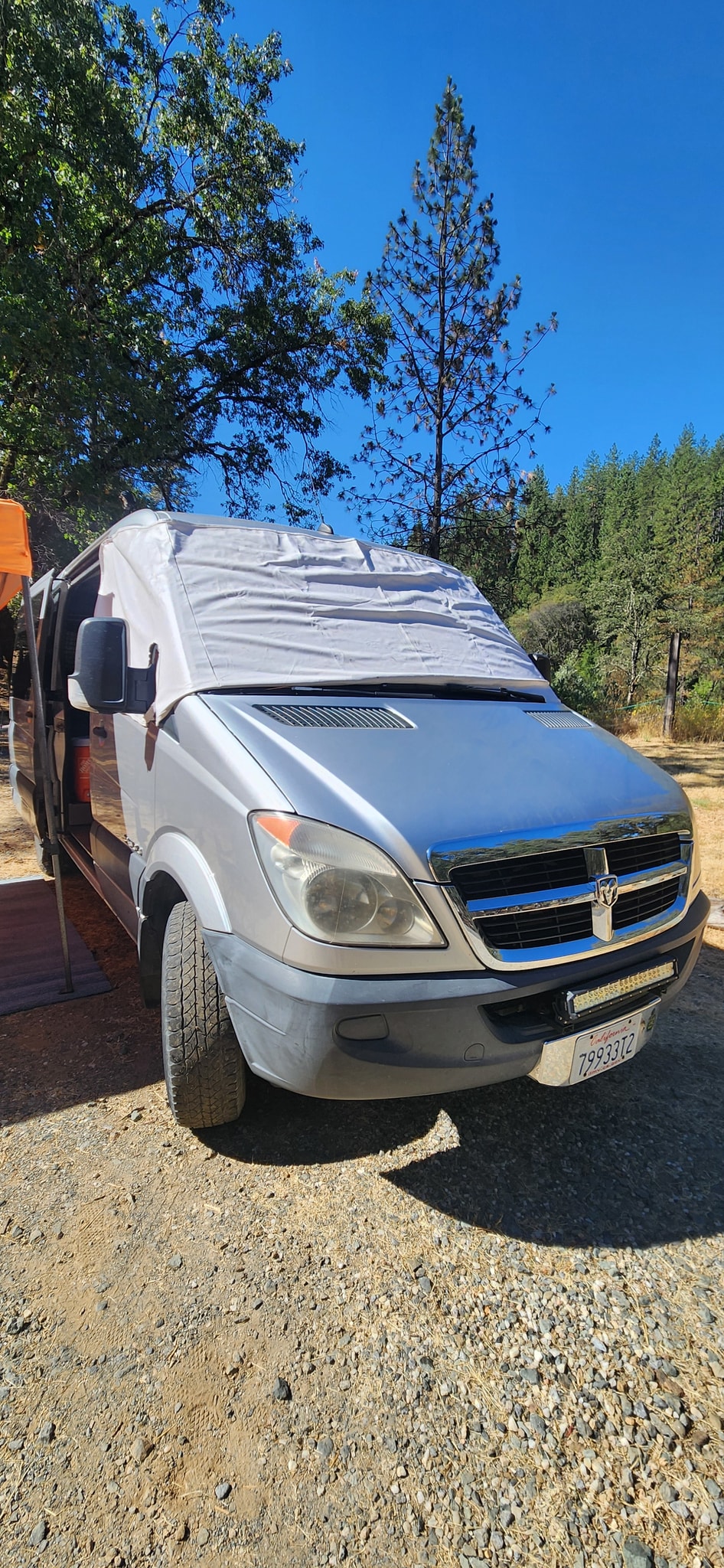  designed for comfortable mobile living.|RV rental: Inside a converted van with elevated bed — photo 11
