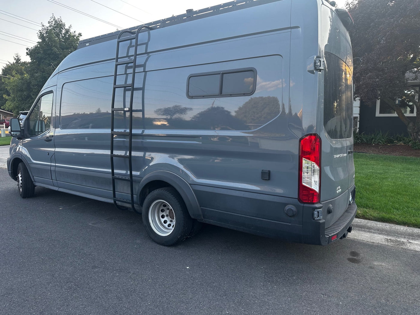 Gray Ford Transit camper van — photo 1