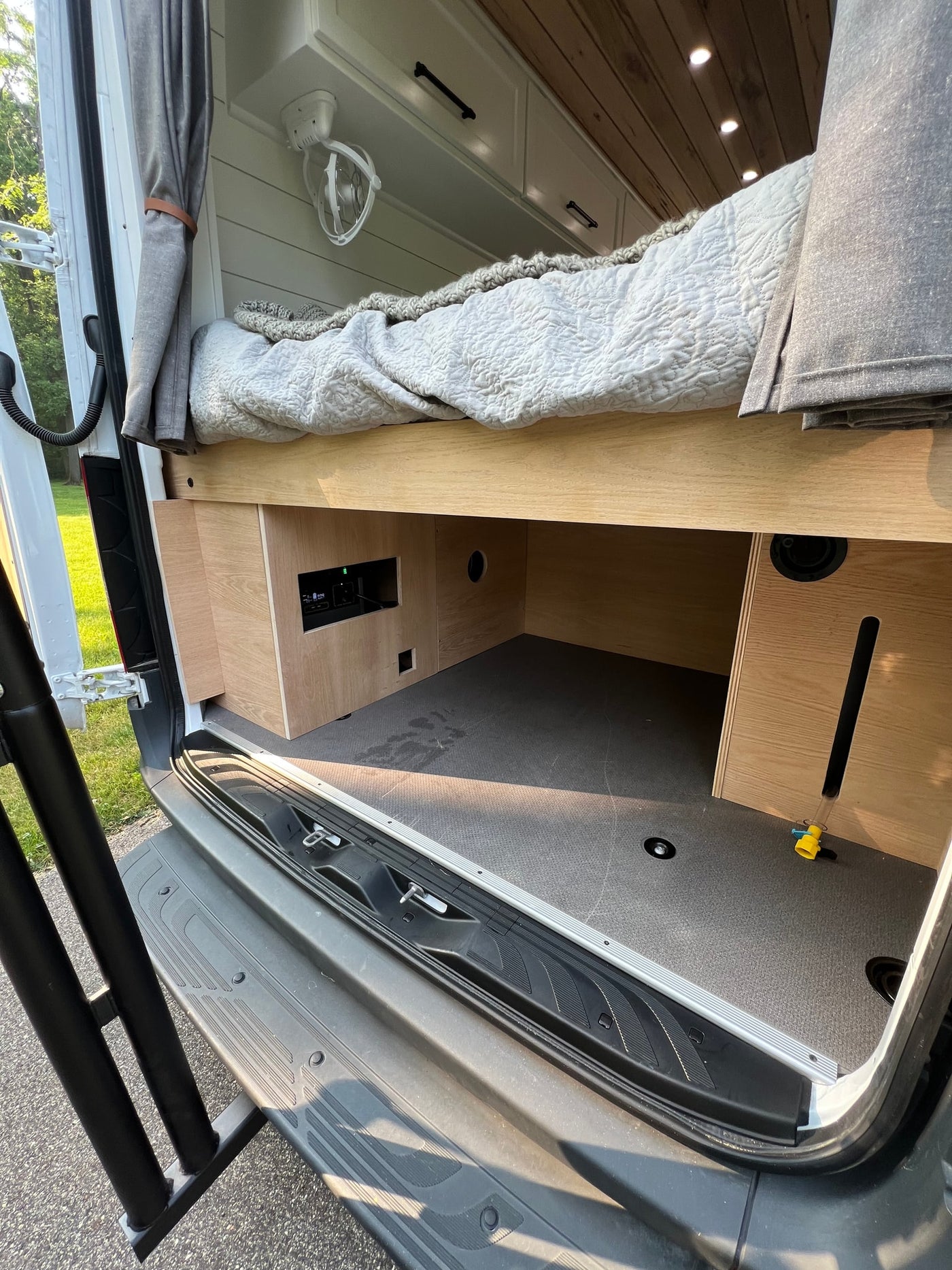  and a pet-friendly hidden area.|An open wooden kitchen drawer in an RV rental — photo 19
