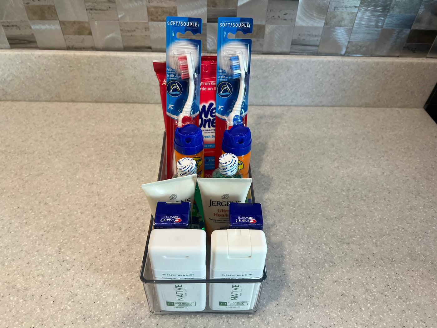 RV rental: Organized travel caddy with two toothbrushes, wipes, mini toothpaste, lotion, and Native shampoo/conditioner. — photo 16