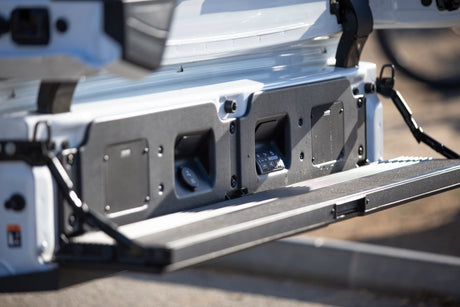 RV rental tailgate with integrated Kicker sound system, 12V power outlet, and controls for outdoor enjoyment.