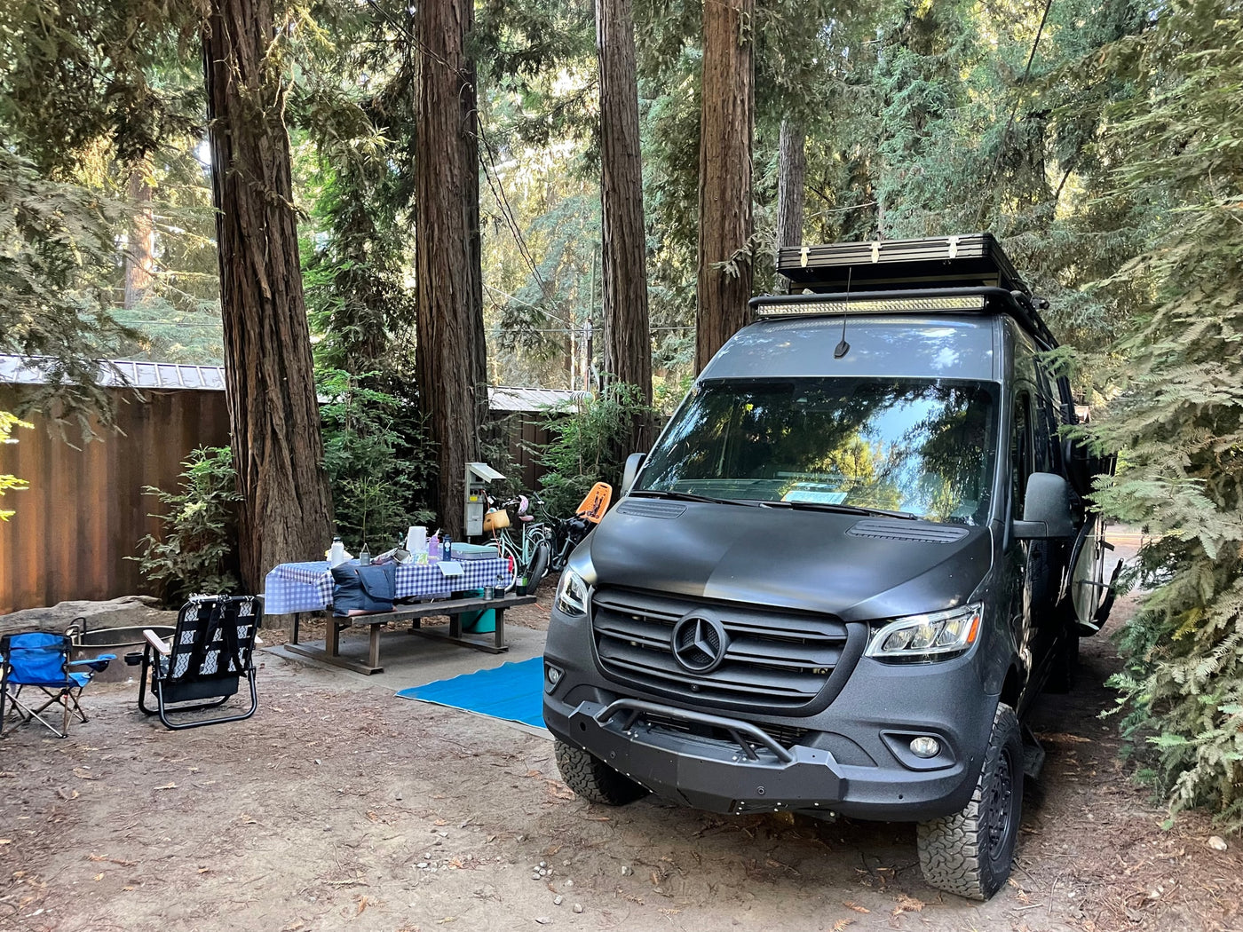  perfectly set up for oceanfront camping.|View inside a modern RV rental camper van: light wood ceiling — photo 13