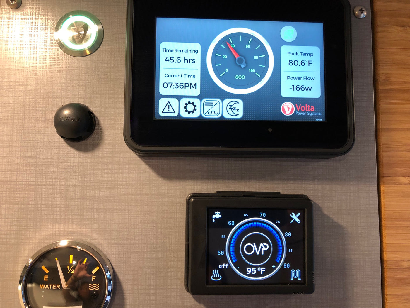 RV rental control panel with Volta power system, water tank level, and water heater temperature displays for vehicle functions. — photo 18