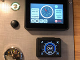 RV rental control panel with Volta power system, water tank level, and water heater temperature displays for vehicle functions.