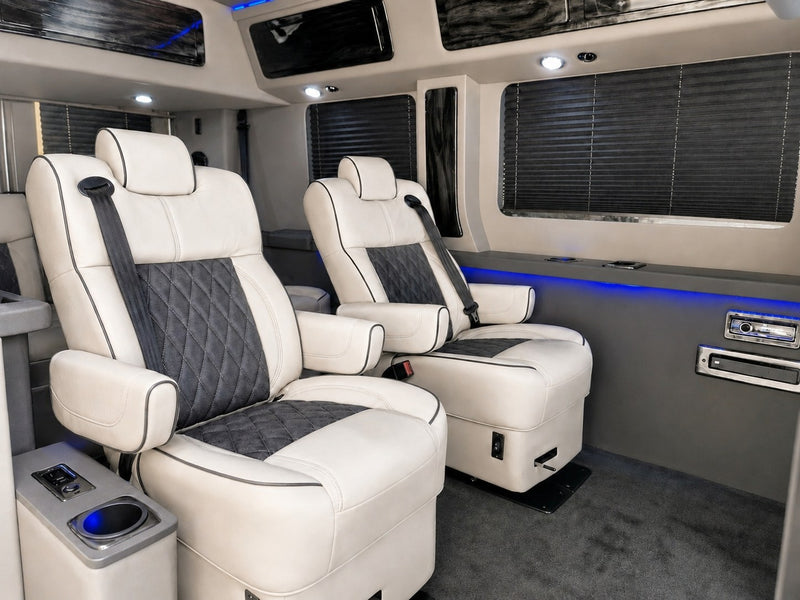  a spacious RV rental perfect for adventure.|This RV rental offers a luxurious interior with plush cream and dark gray quilted seats — photo 5