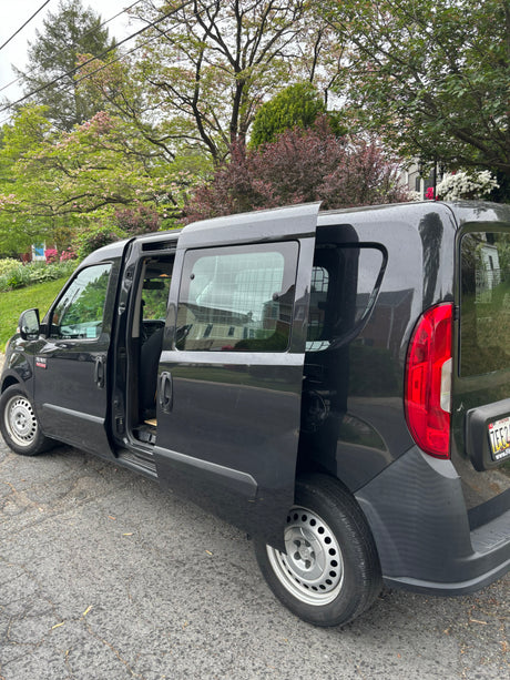 Dark gray Ram ProMaster City van, doors open, ready for your next project. Part of our versatile rv rental options.