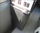 RV rental interior: control panel with switches, a built-in 'AO KOOL' fridge/cooler, and durable patterned floor.