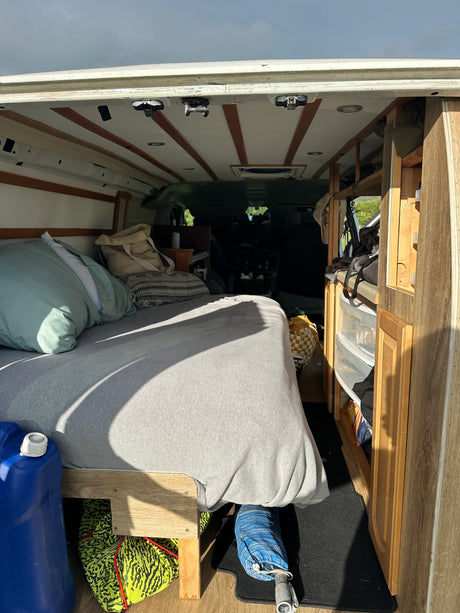Experience van life in this cozy rv rental. Features a comfortable bed, smart storage, and essentials for your adventure.