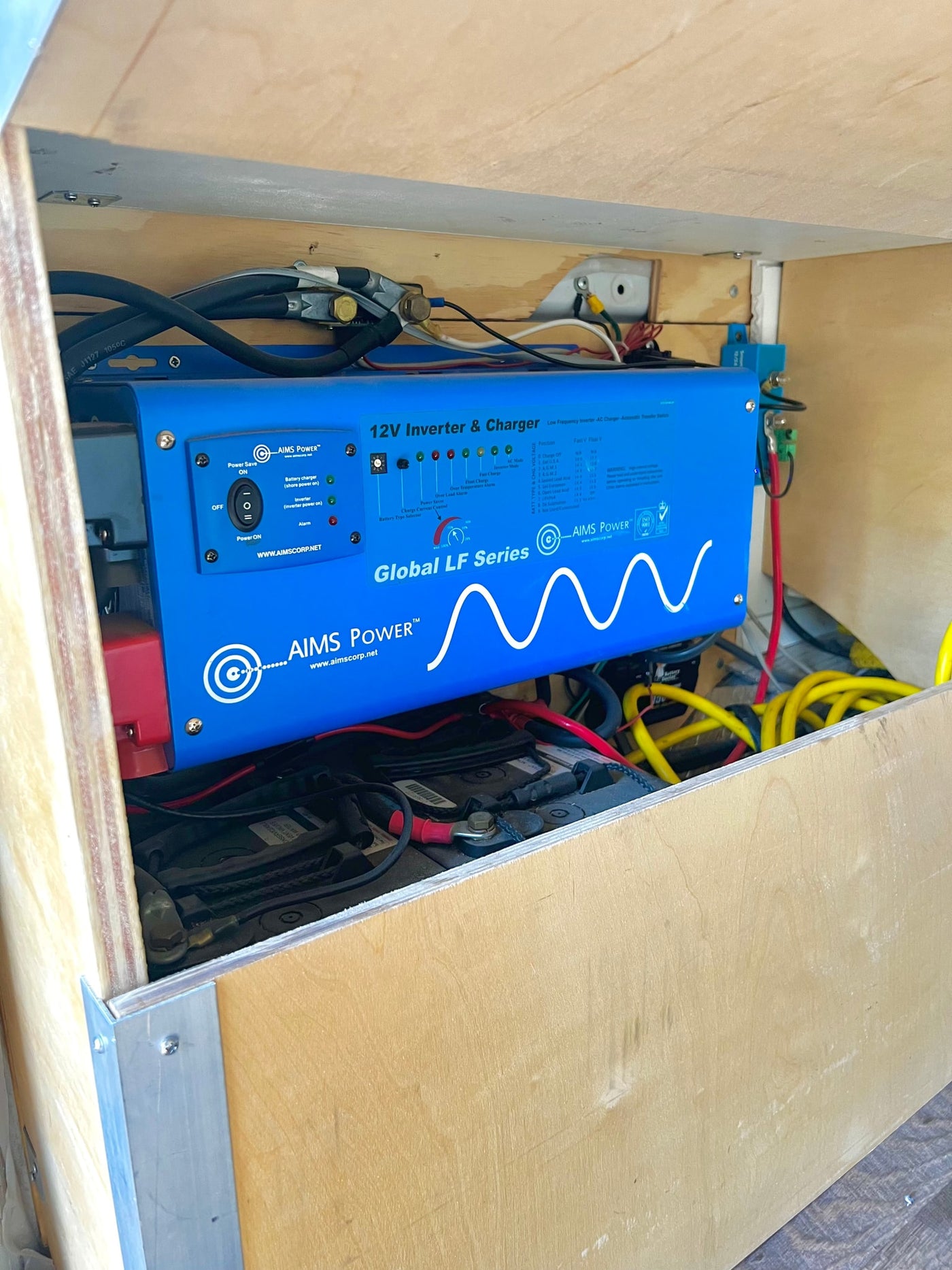RV rental's essential power system: AIMS inverter/charger and batteries, crucial for off-grid electrical supply. — photo 20