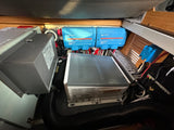 RV rental electrical power system featuring Victron DC distributors, Magnum inverter/charger, and cooling unit.