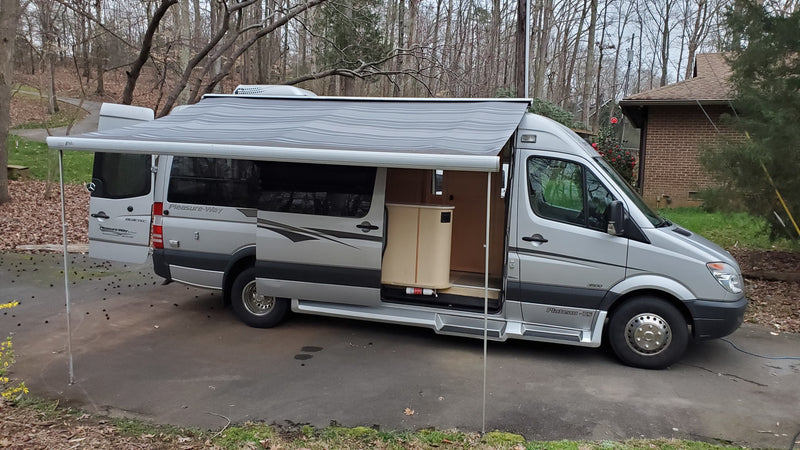  parked on a paved lot. Ideal for road trips!|Silver Pleasure-Way RV rental with extended awning — photo 5