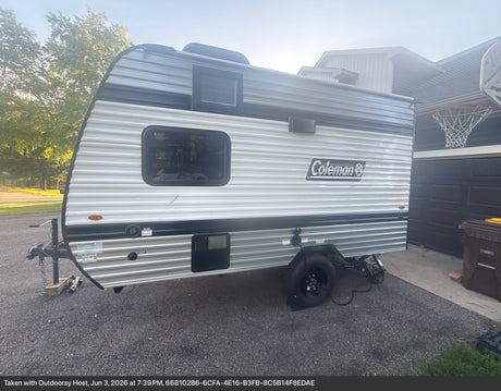  and an AC unit for comfortable travel.|Compact RV rental bathroom with a toilet
