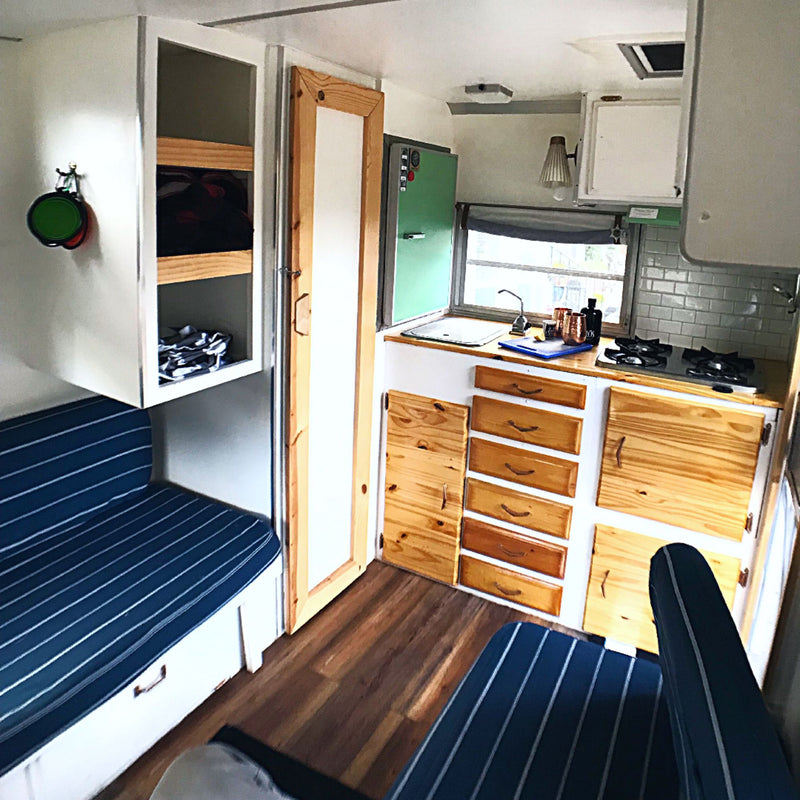  OR) on a teal background.|RV rental: Stylish interior with nautical striped cushions — photo 2