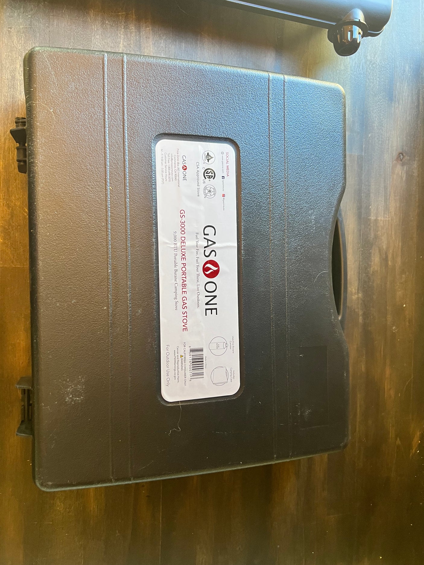A GASONE GS-3000 portable gas stove in its case, ideal for **RV rental** trips, camping, and outdoor cooking.