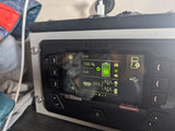 The Redarc RedVision system display shows 100% battery in an RV rental, monitoring power for lights, fridge, and more.