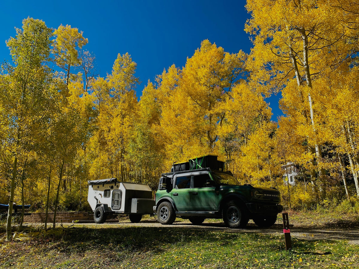  and organized storage for camping meals.|An RV rental outdoor kitchen setup with a portable stove — photo 8