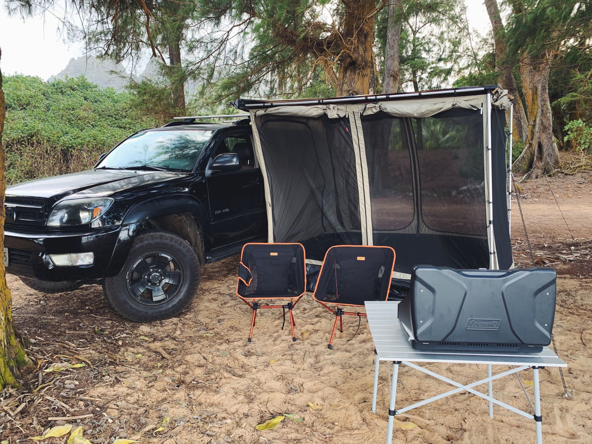 Black SUV with attached screen room