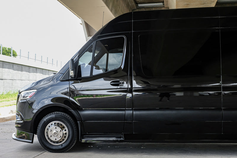 Shiny black Mercedes-Benz Sprinter van, a top choice for your RV rental, parked under an overpass. — photo 14